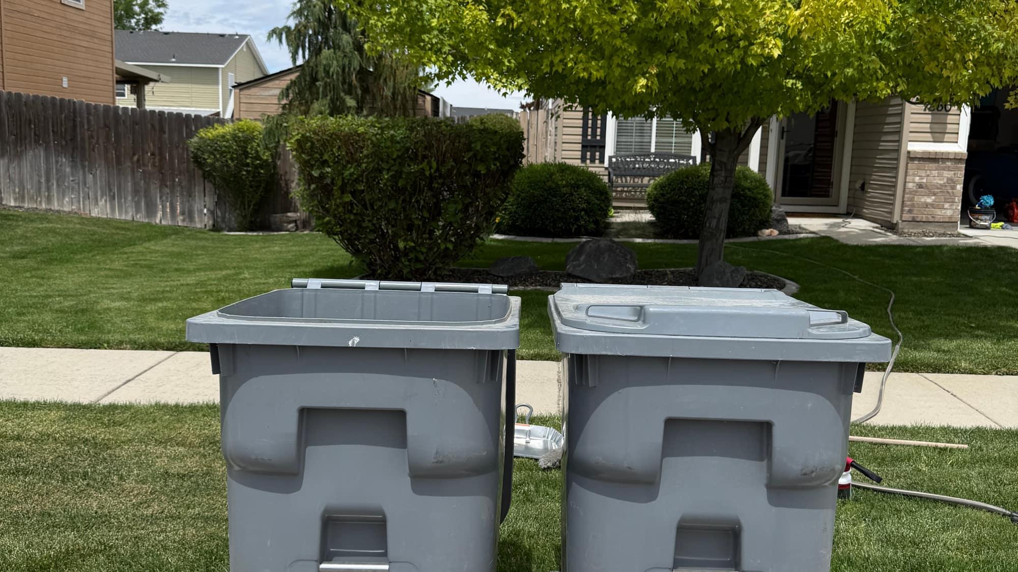 Two freshly cleaned trash bins side by side on a Treasure Valley curb